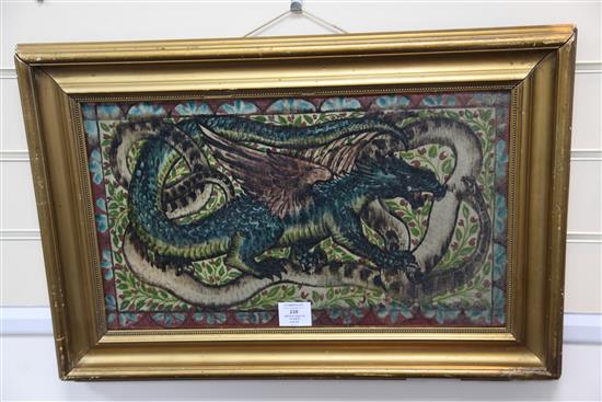 Attributed to John Pearson. An Arts & Crafts dragon and serpent pottery plaque, c.1905, 29 x 50.5cm, gilt frame